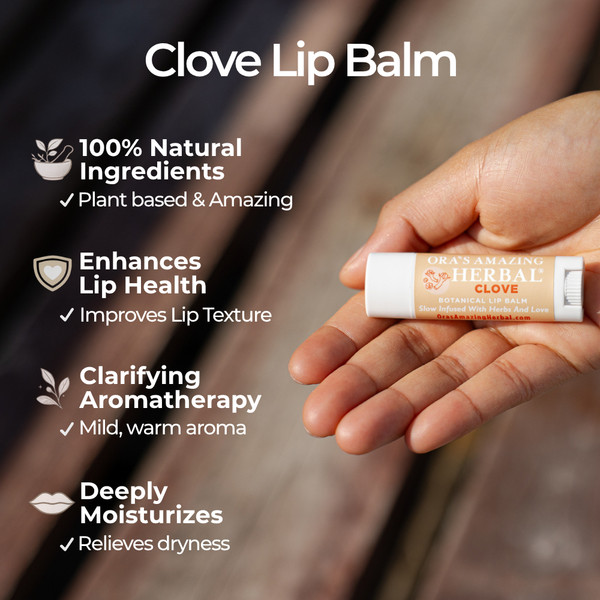 Clove lip balm held in a hand with product details on a blurred out door background.
