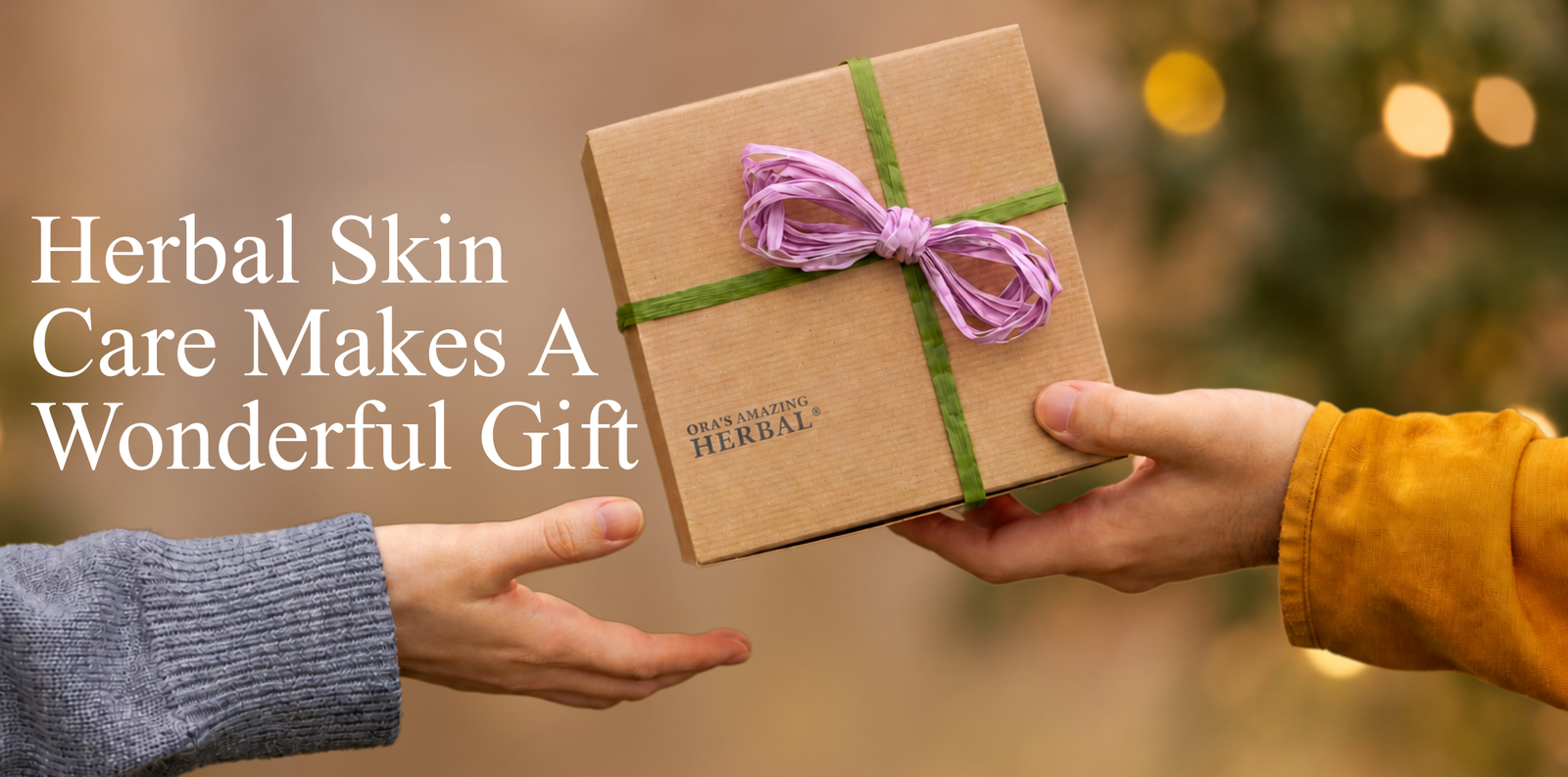 A person in a gray sweater offers a small brown kraft gift box wrapped with a green ribbon and purple bow to another person wearing a mustard yellow sleeve. The box has 'HERBAL SKIN CARE' printed on it.
