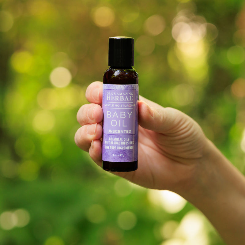Baby Oil 2oz Lifestyle Outdoor Human Hand