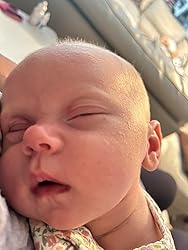 Newborn baby sleeping with and calming face