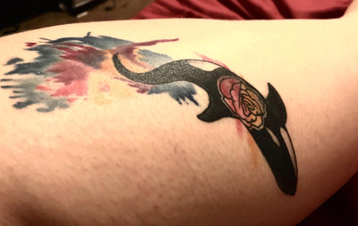 Clearer and healed tattoo in person's leg