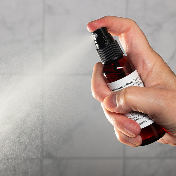 Cool Balance Room Spray 2oz Lifestyle with Human Hand Spraying Square Microbatch Label