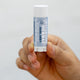 Earl Grey Lip Balm Lifestyle Outdoor Human Hand White Wall