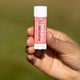 Mintyliptus Lip Balm Lifestyle Outdoor Human Hand Green Background
