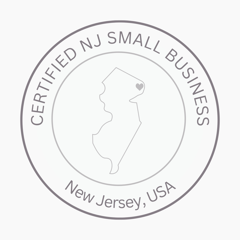 A circular gray seal reading 'CERTIFIED NJ SMALL BUSINESS' around a map outline of New Jersey with a small heart, plus 'New Jersey, USA' at the bottom, on a light gray background.