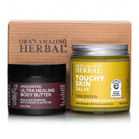a jar of salve and a container of body butter on a white background.