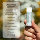 Unscented Lip balm with ingredients listed on a blurred natural background