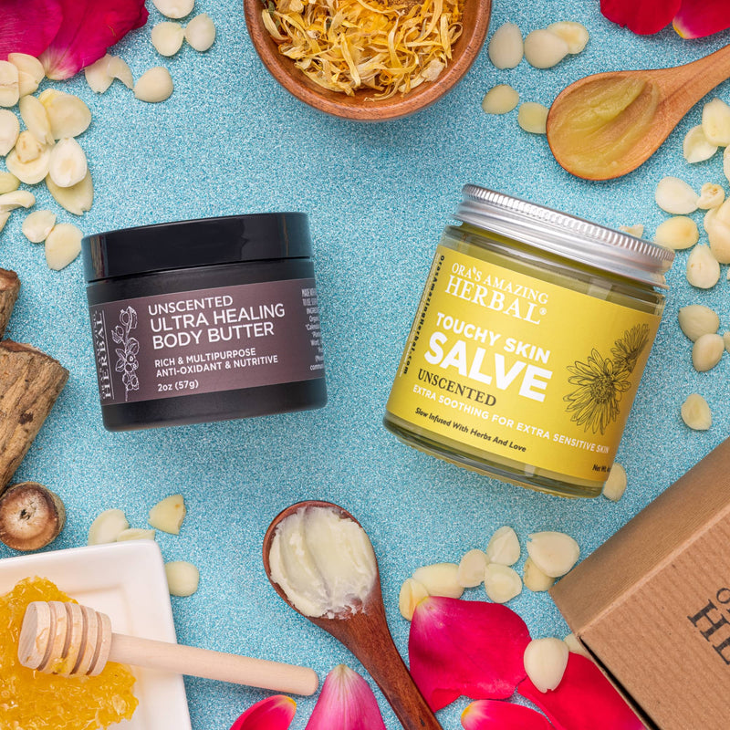 Photo of eczema cream salve and butter unscented eczema care set on a blue background surrounded by ingredients