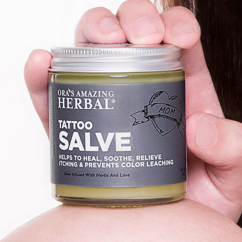 Tattoo Salve 4oz Lifestyle Indoor Human Hand Cropped